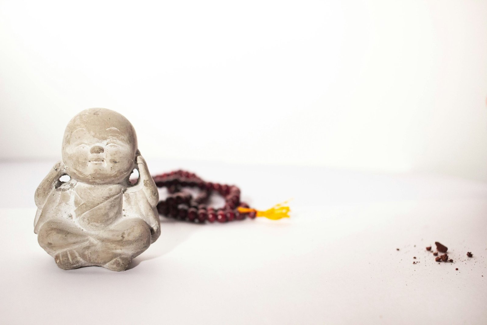 gray ceramic figurine on white table